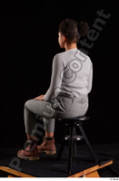  Zahara  1 brown workers dressed grey sweatshirt grey trousers sitting whole body 0002.jpg